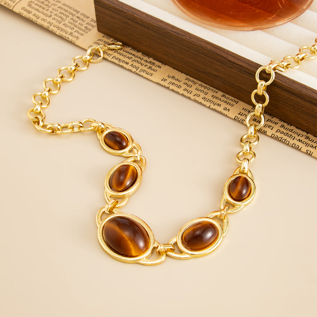 Tiger's Eye‌ and Goldtone Graduated Oval Station Necklace, vintage-inspired design, detail close-up