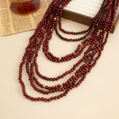 Red Wood and Goldtone Star Beaded Chain Layered Necklace, vintage-inspired design, detail close-up