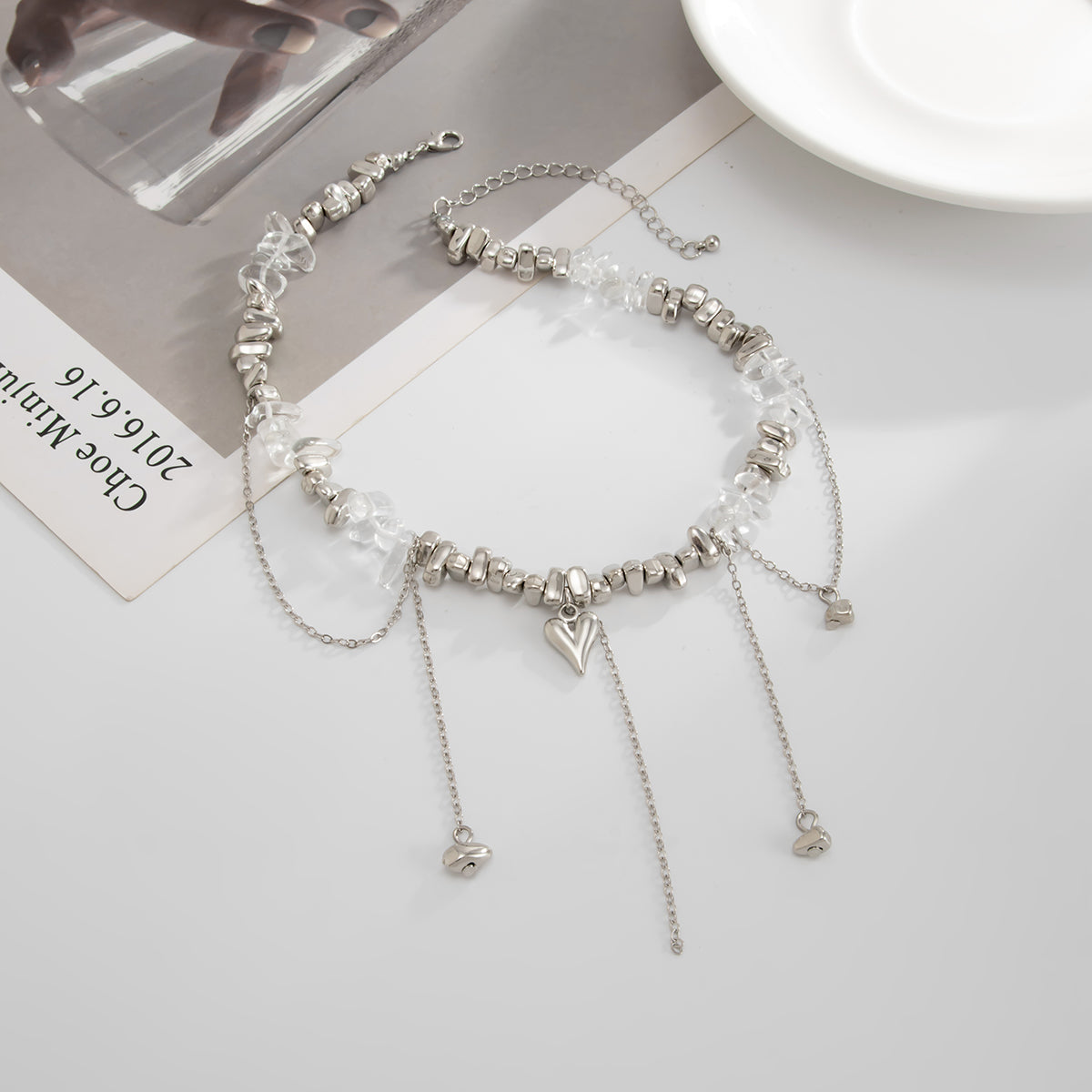 Clear Resin and Silvertone Heart Tassel Necklace, everyday style, side view