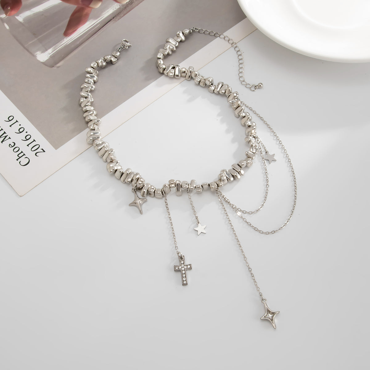 Cubic Zirconia and Silvertone Cross Star Drop Necklace, vintage-inspired design, side view