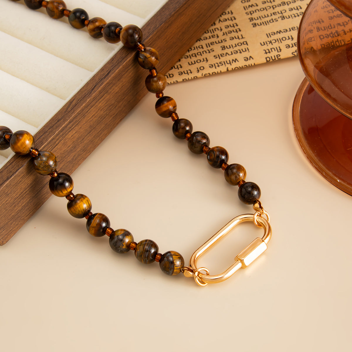 Tigereye‌ and Goldtone Open Oval Collar Necklace, botanical inspired, detail close-up