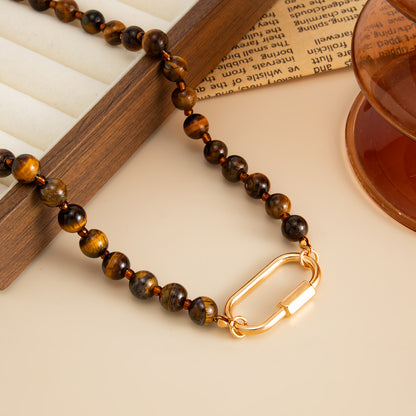 Tigereye‌ and Goldtone Open Oval Collar Necklace, botanical inspired, detail close-up