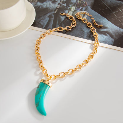 Blue Resin and Goldtone Wolf Tooth Pendant Necklace, everyday style, side view