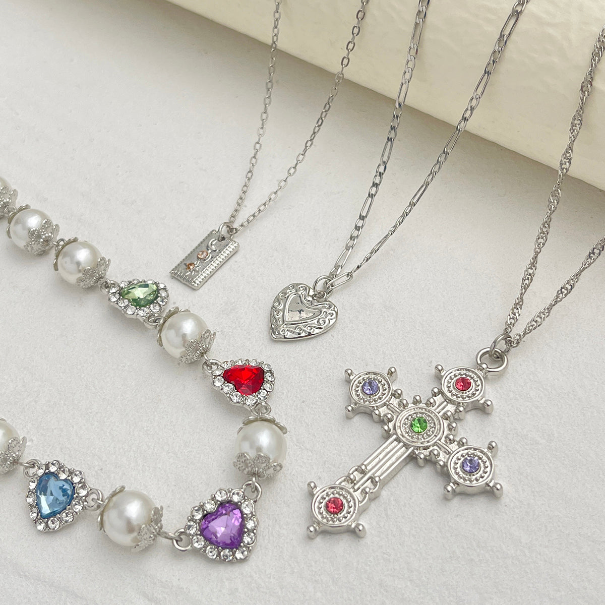 Multi-Colored Crystal and Cubic Zirconia Pearl Silvertone Heart Cross Pendant Necklace Set, silver pendant..., side view