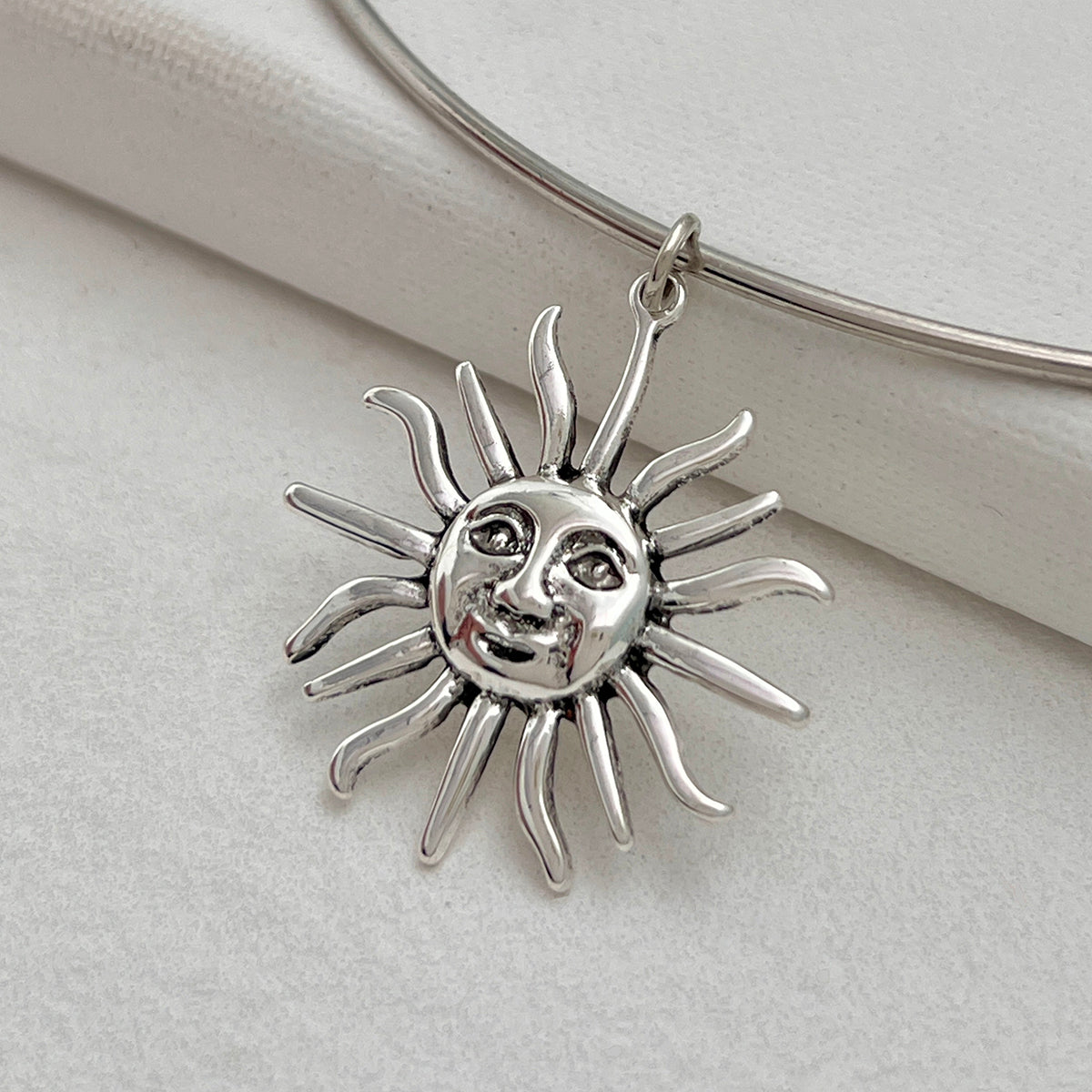 Silvertone Sun Pendant Choker, everyday style, detail close-up