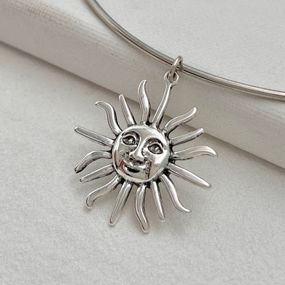 Silvertone Sun Pendant Choker, everyday style, detail close-up