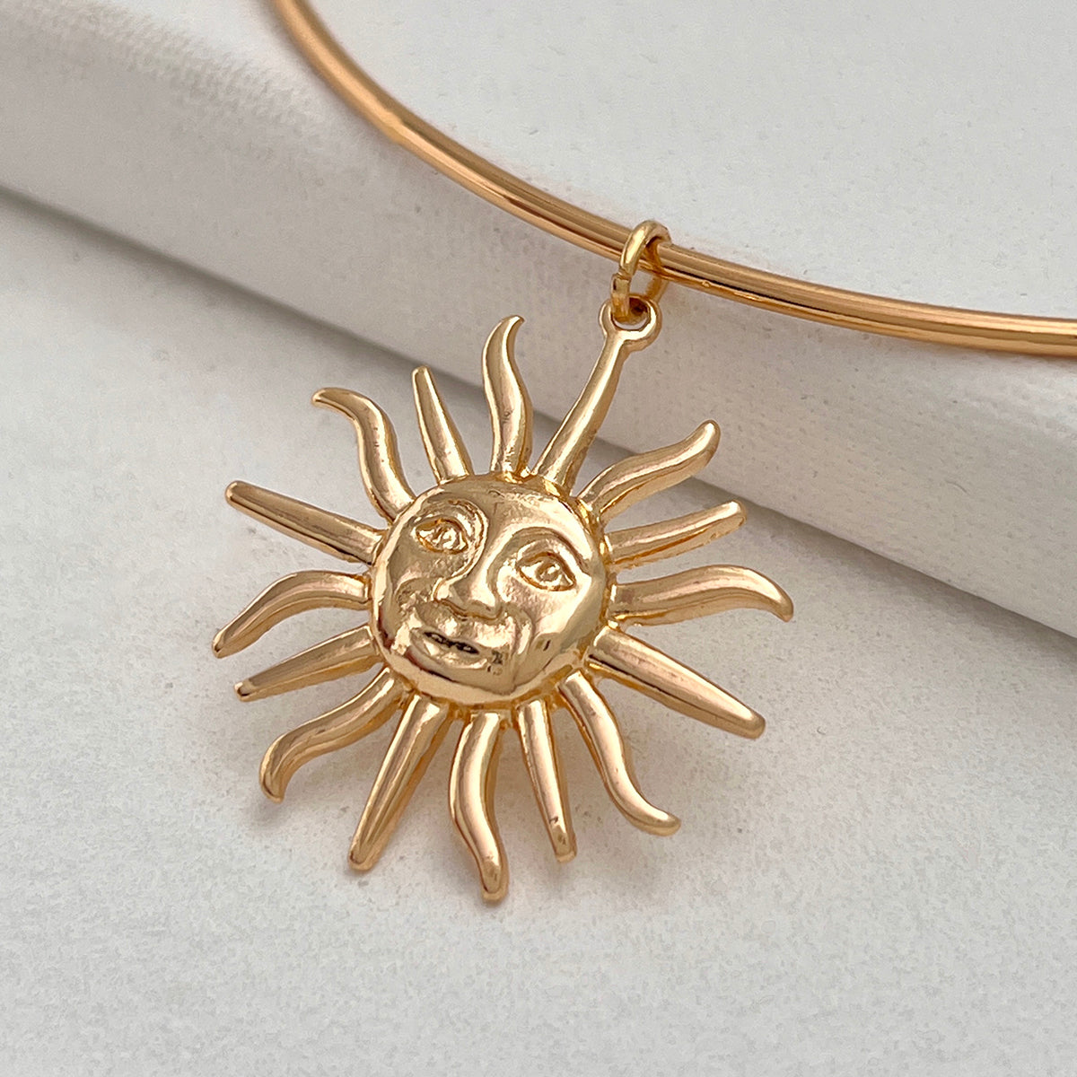 Goldtone Sun Pendant Choker, vintage-inspired design, detail close-up