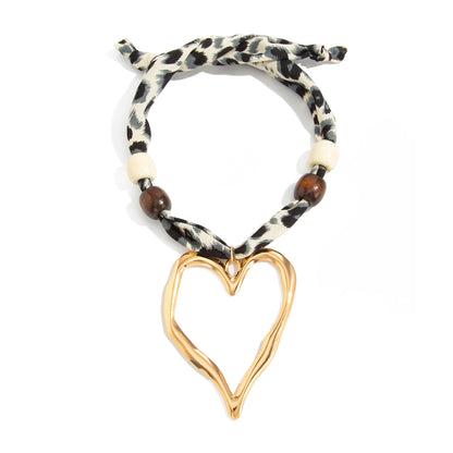 Polyster and White Wood Goldtone Open Heart Pendant Necklace, botanical inspired, front view