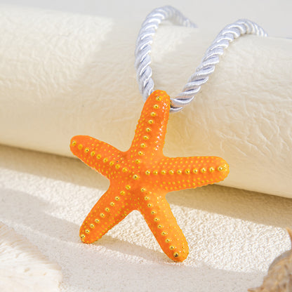 Thick Polyster Cord and Orange Enamel Goldtone Starfish Statement Necklace, dainty minimalist design, side view