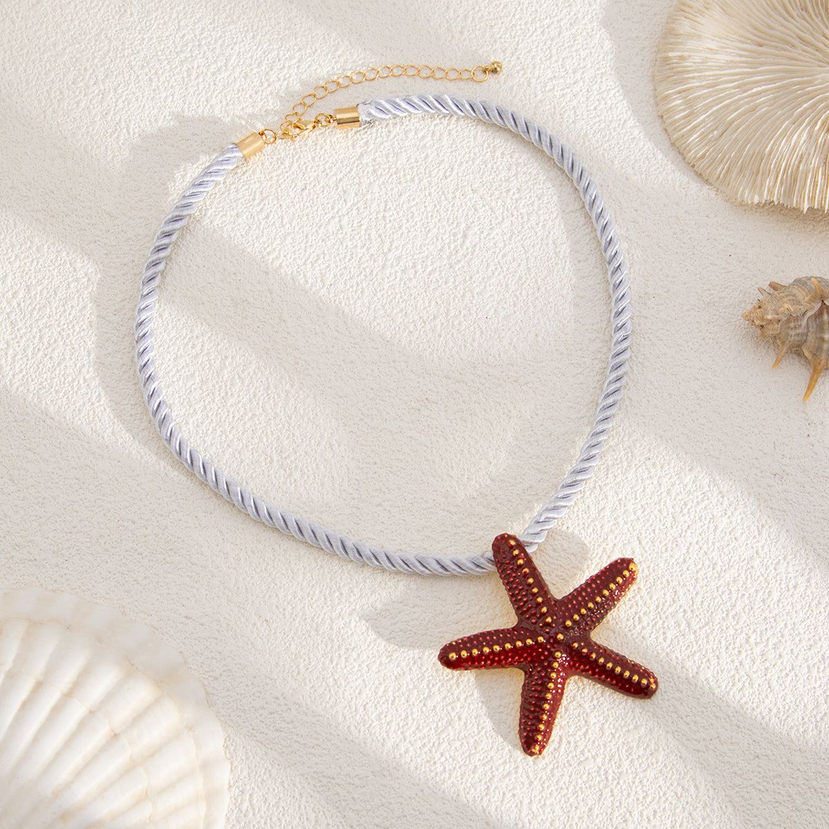 Thick Polyster Cord and Red Enamel Goldtone Starfish Statement Necklace, botanical inspired, detail close-up