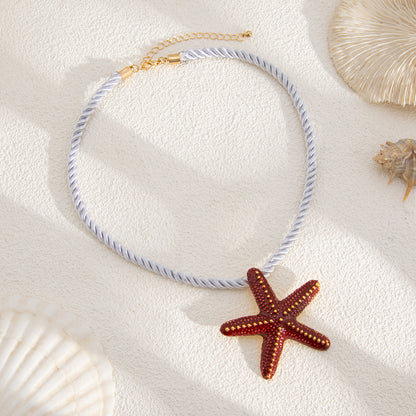 Thick Polyster Cord and Red Enamel Goldtone Starfish Statement Necklace, botanical inspired, detail close-up