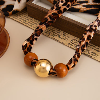 Polyster and Wood Goldtone Ball Collar Necklace, vintage-inspired design, side view