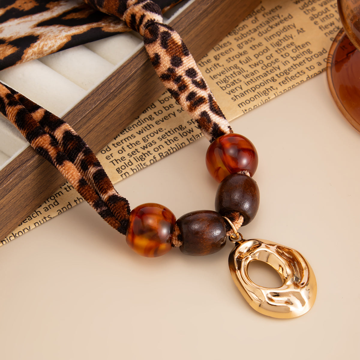 Polyster and Resin Wood Goldtone Pendant Leopard Print Necklace, vintage-inspired design, detail close-up