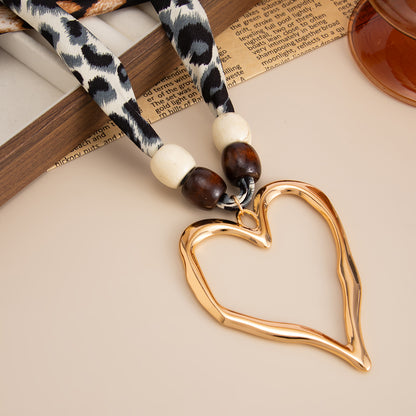 Polyster and White Wood Goldtone Open Heart Pendant Necklace, botanical inspired, detail close-up