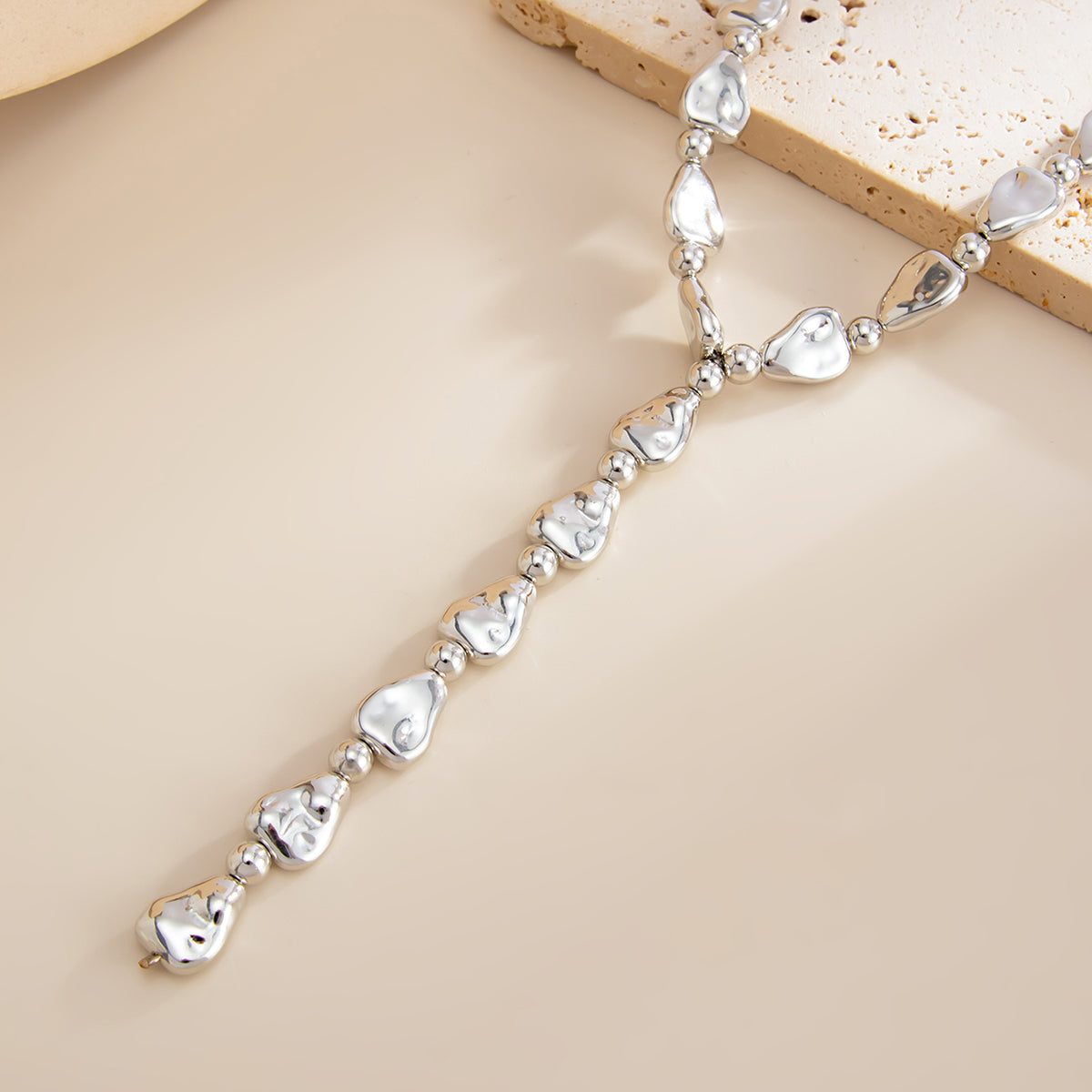 Silvertone Hammered Drop Y-Necklace, botanical inspired, side view