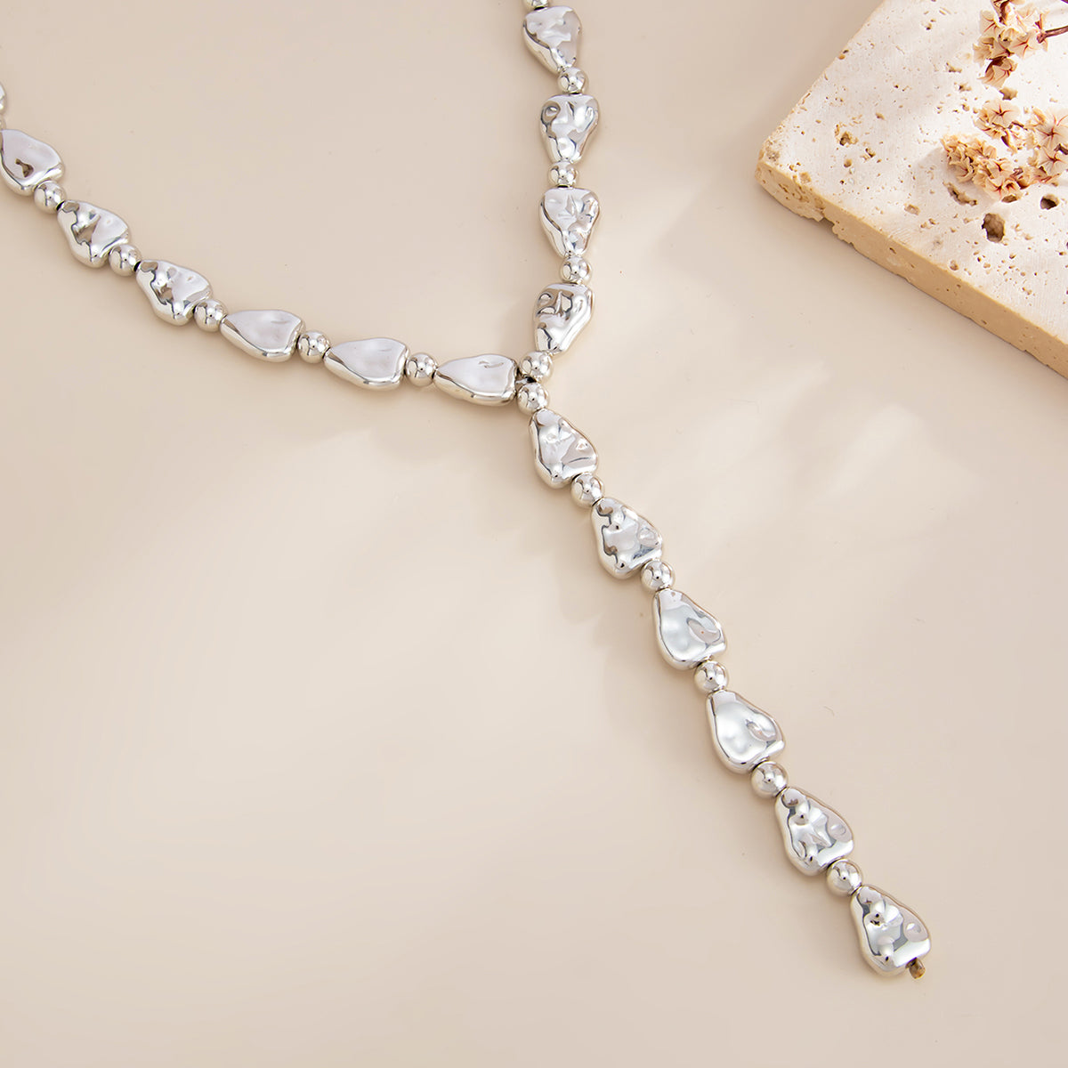 Silvertone Hammered Drop Y-Necklace, botanical inspired, detail close-up