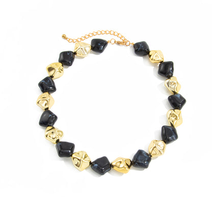 Black Resin and Goldtone Irregular Rhombus Station Collar Necklace, dainty minimalist design, front view