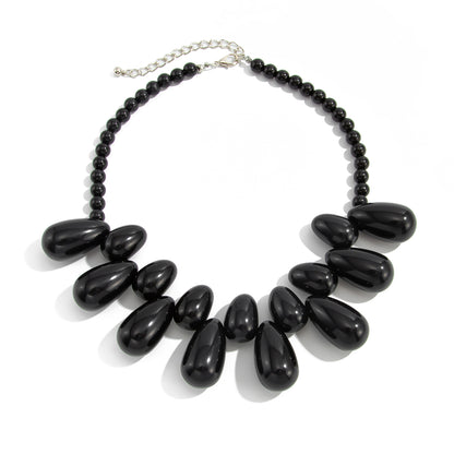 Black Resin and Silvertone Drops Collar Necklace, vintage-inspired design, front view