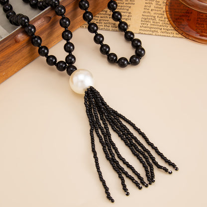 Black Resin and Pearl Big Ball Tassel Necklace, dainty minimalist design, detail close-up