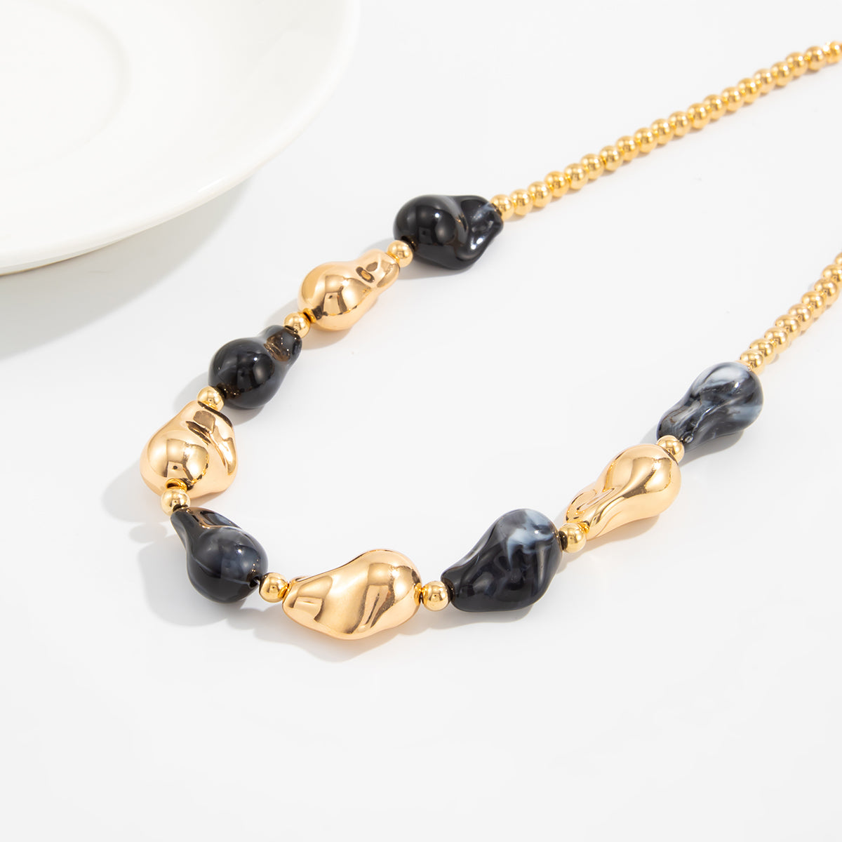 Black Resin and Goldtone Irregular Drop Station Collar Necklace, everyday style, styled look
