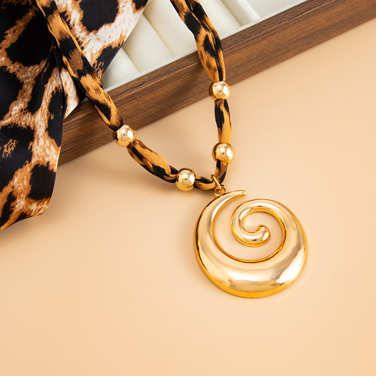 Polyster and Goldtone Vortex Pendant Necklace, everyday style, detail close-up