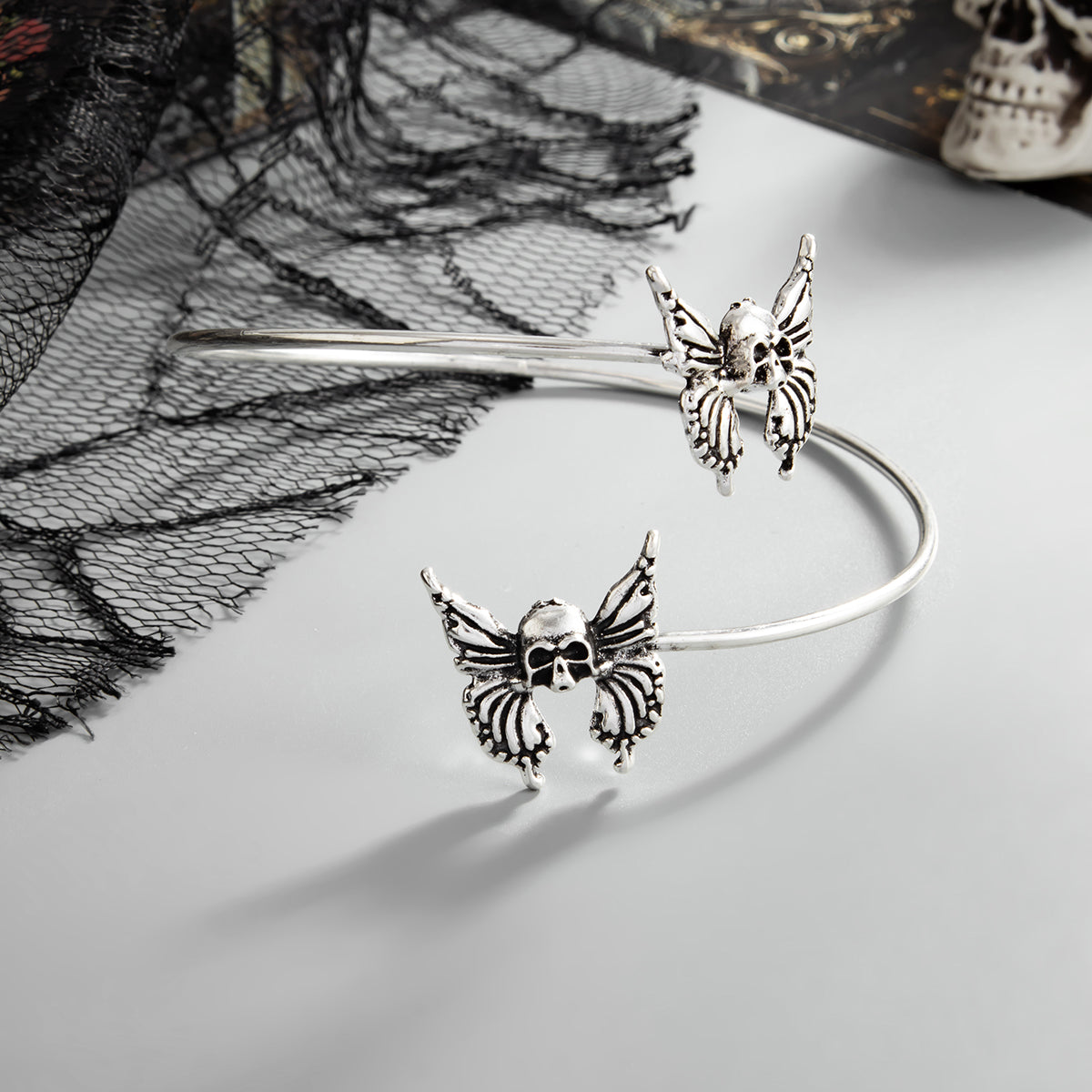 Silvertone Dual-Skull-Butterflies Bypass Arm Cuff, everyday style, side view