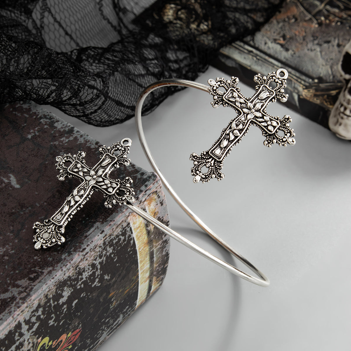 Silvertone Dual-Floral-Cross Bypass Arm Cuff, botanical inspired, detail close-up