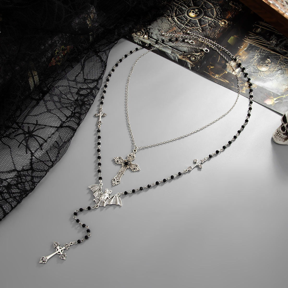 Black Acrylic and Silvertone Bat Cross Drop Necklace Set, silver pendant necklace for women, side view
