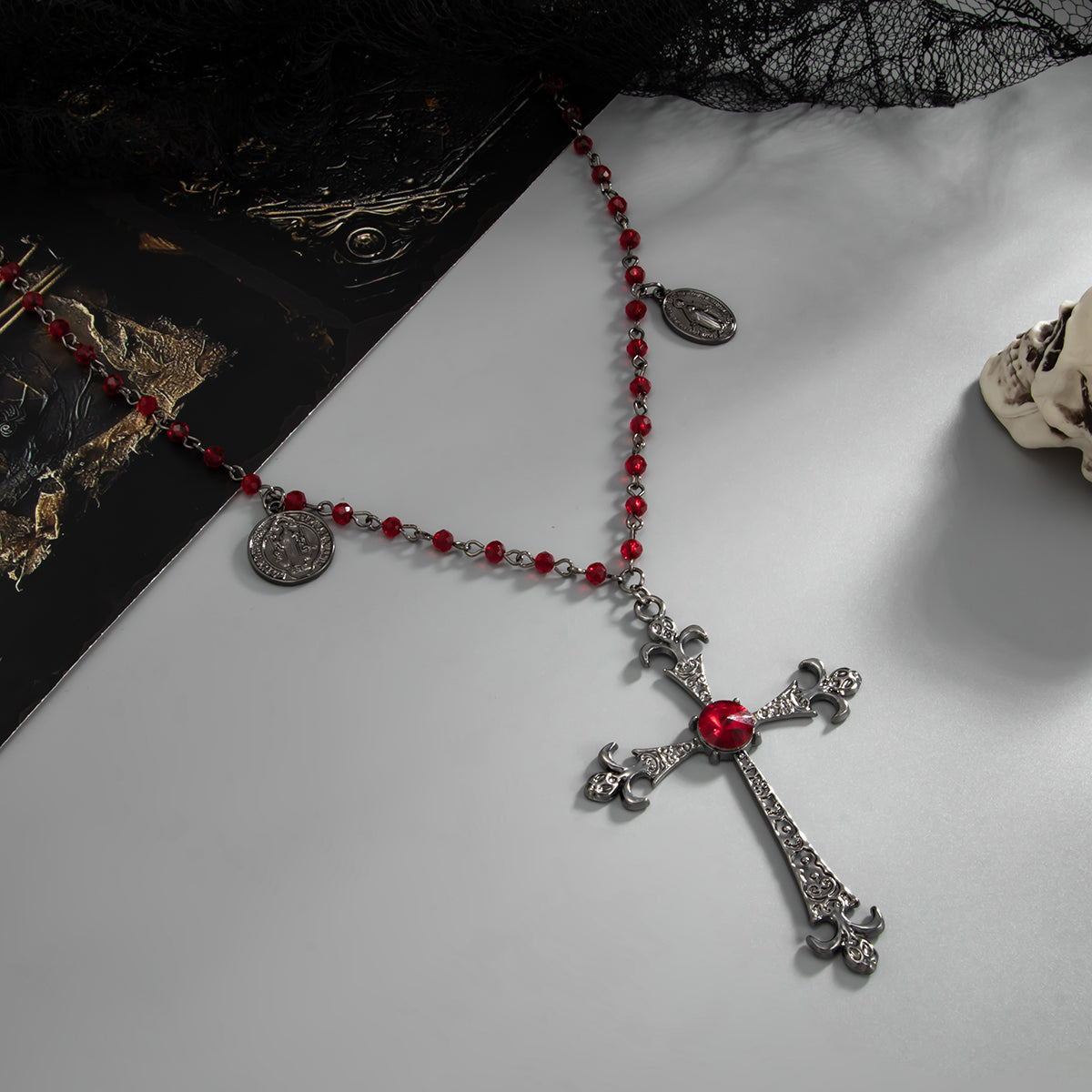 Red Cubic Zirconia and Acrylic Blacktone Coin Cross Pendant Necklace, botanical inspired, side view