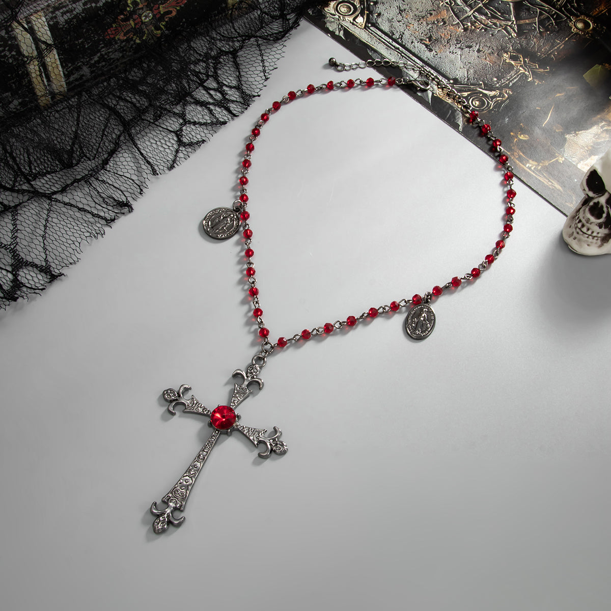 Red Cubic Zirconia and Acrylic Blacktone Coin Cross Pendant Necklace, botanical inspired, detail close-up