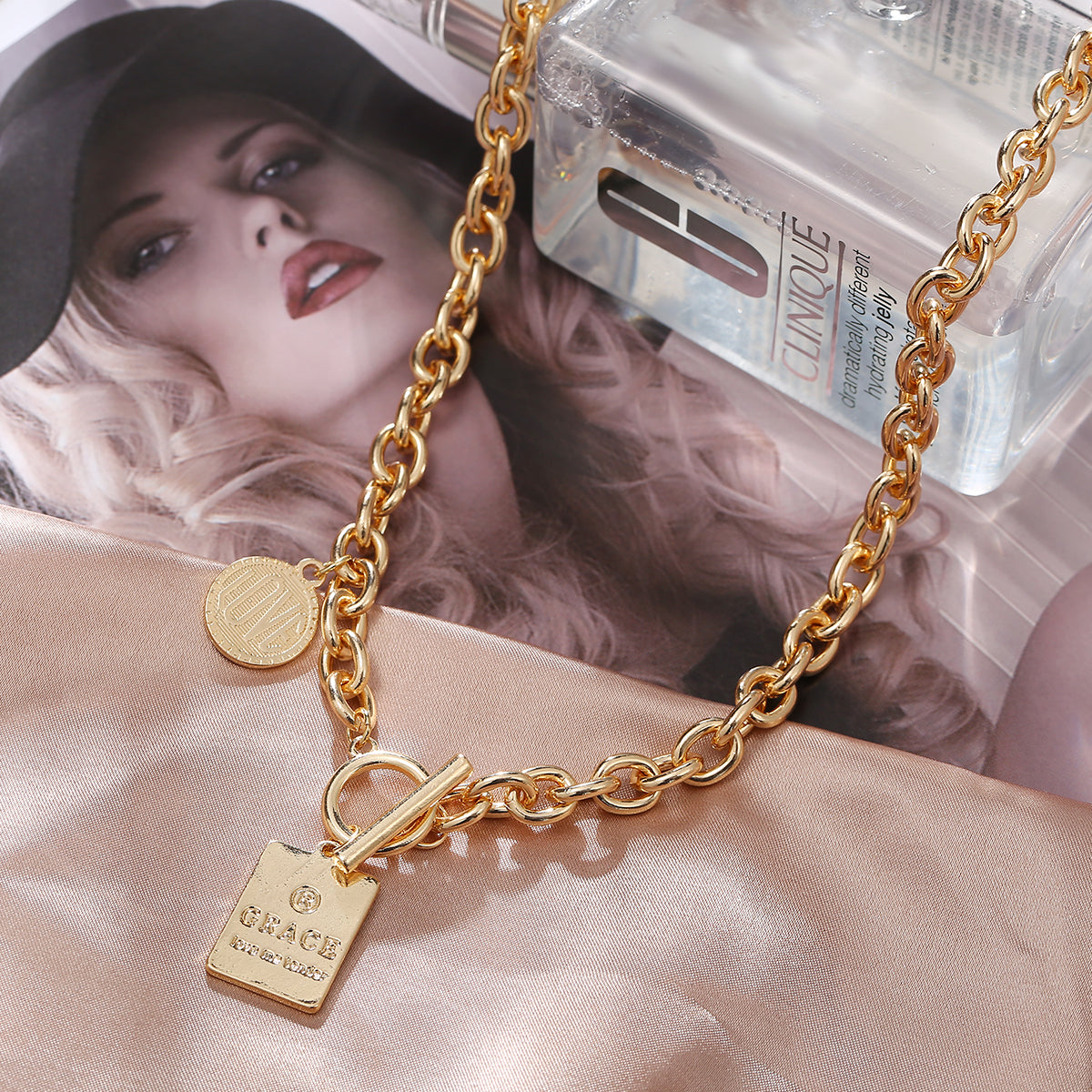 Chic 18K gold-plated necklace adorned with a "Grace" pendant, a timeless piece that enhances any jewelry collection.