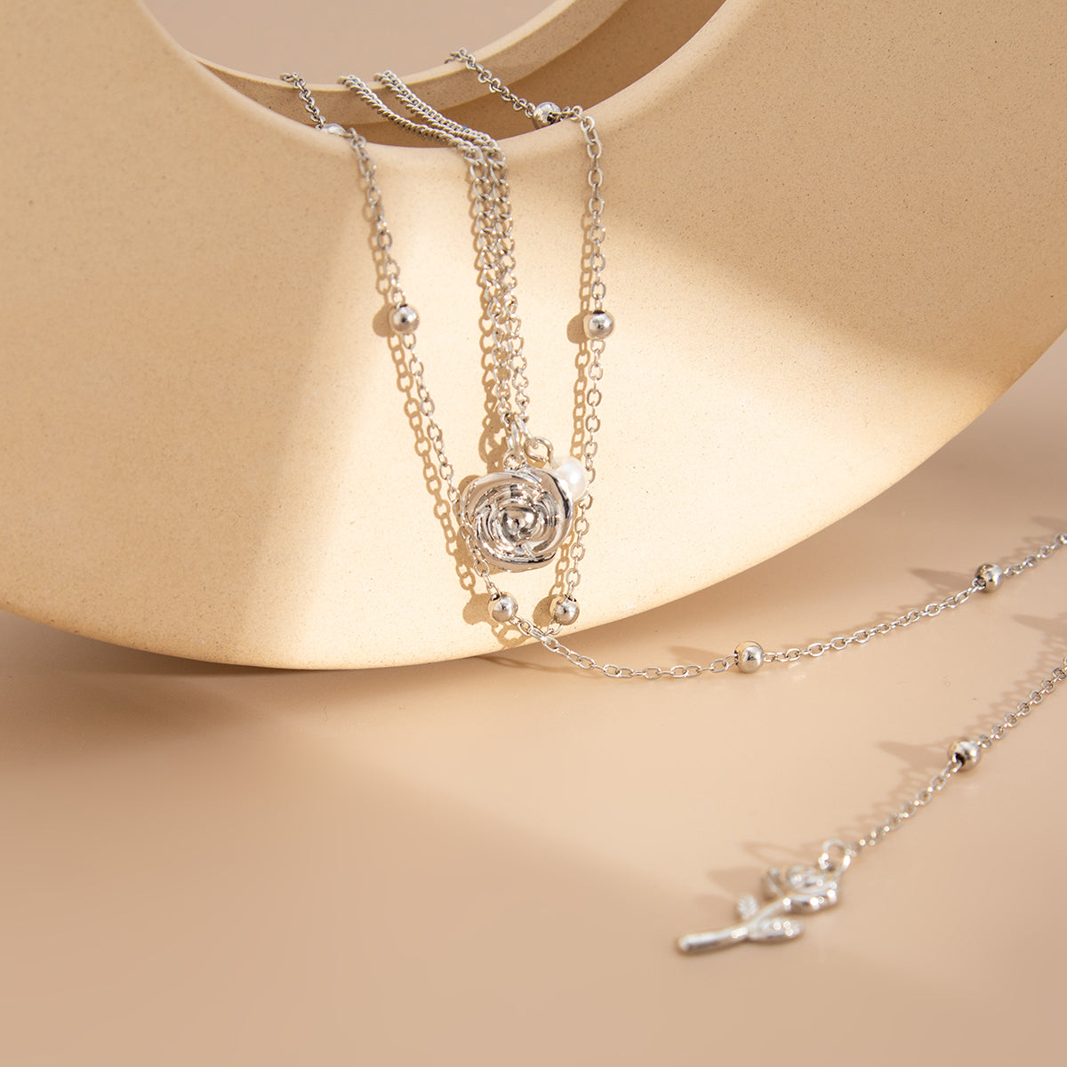 Pearl and Silvertone Rose Drop Layered Necklace, vintage-inspired design, side view