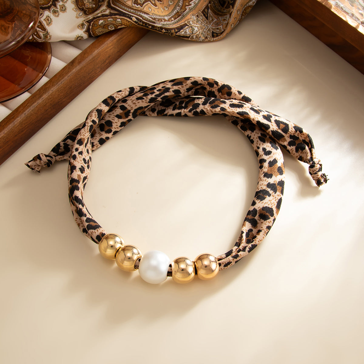 Leopard Print Polyster and Pearl Goldtone Ball Collar Necklace, dainty minimalist design, side view