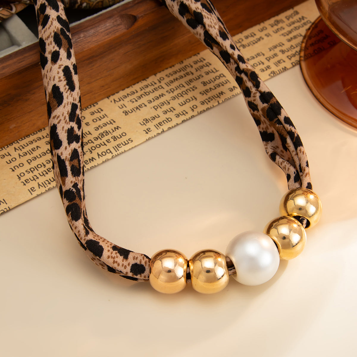 Leopard Print Polyster and Pearl Goldtone Ball Collar Necklace, dainty minimalist design, detail close-up
