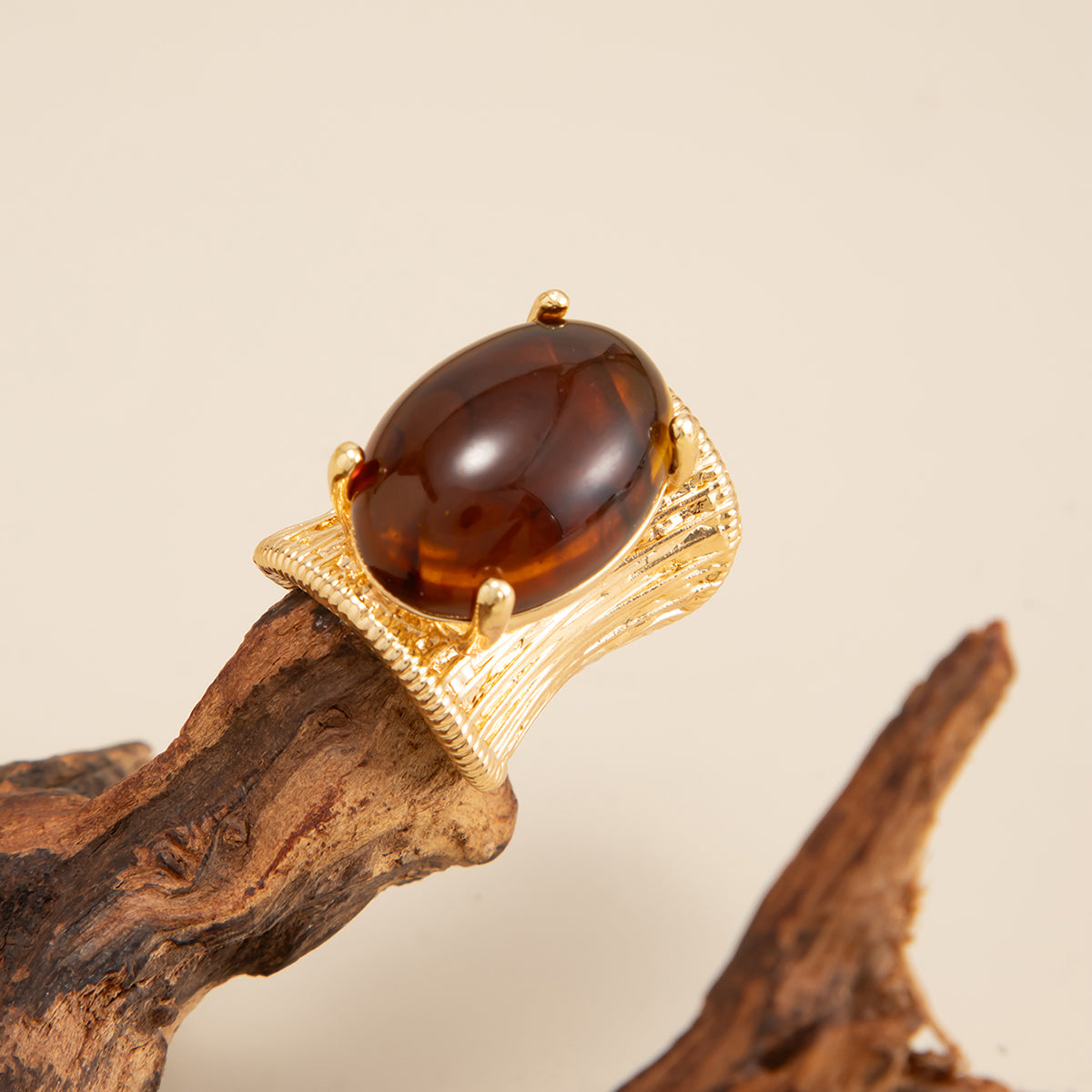Amber Resin and Goldtone Prong-Set Oval Open Ring, botanical inspired, detail close-up
