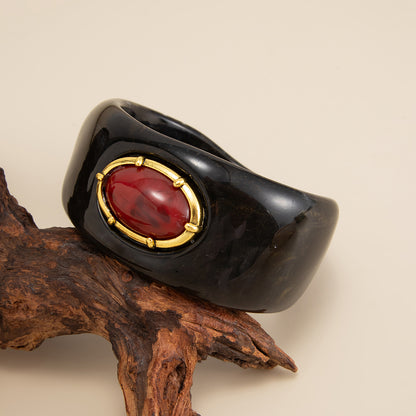 Black Resin and Goldtone Oval Bangle Bracelet, gold bangle bracelet, vintage-inspired design, side view