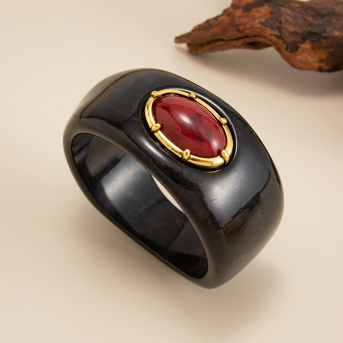 Black Resin and Goldtone Oval Bangle Bracelet, gold bangle bracelet, vintage-inspired design, detail close-up