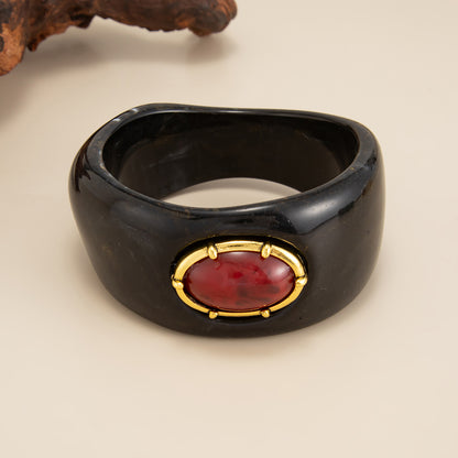 Black Resin and Goldtone Oval Bangle Bracelet, gold bangle bracelet, vintage-inspired design, lifestyle look