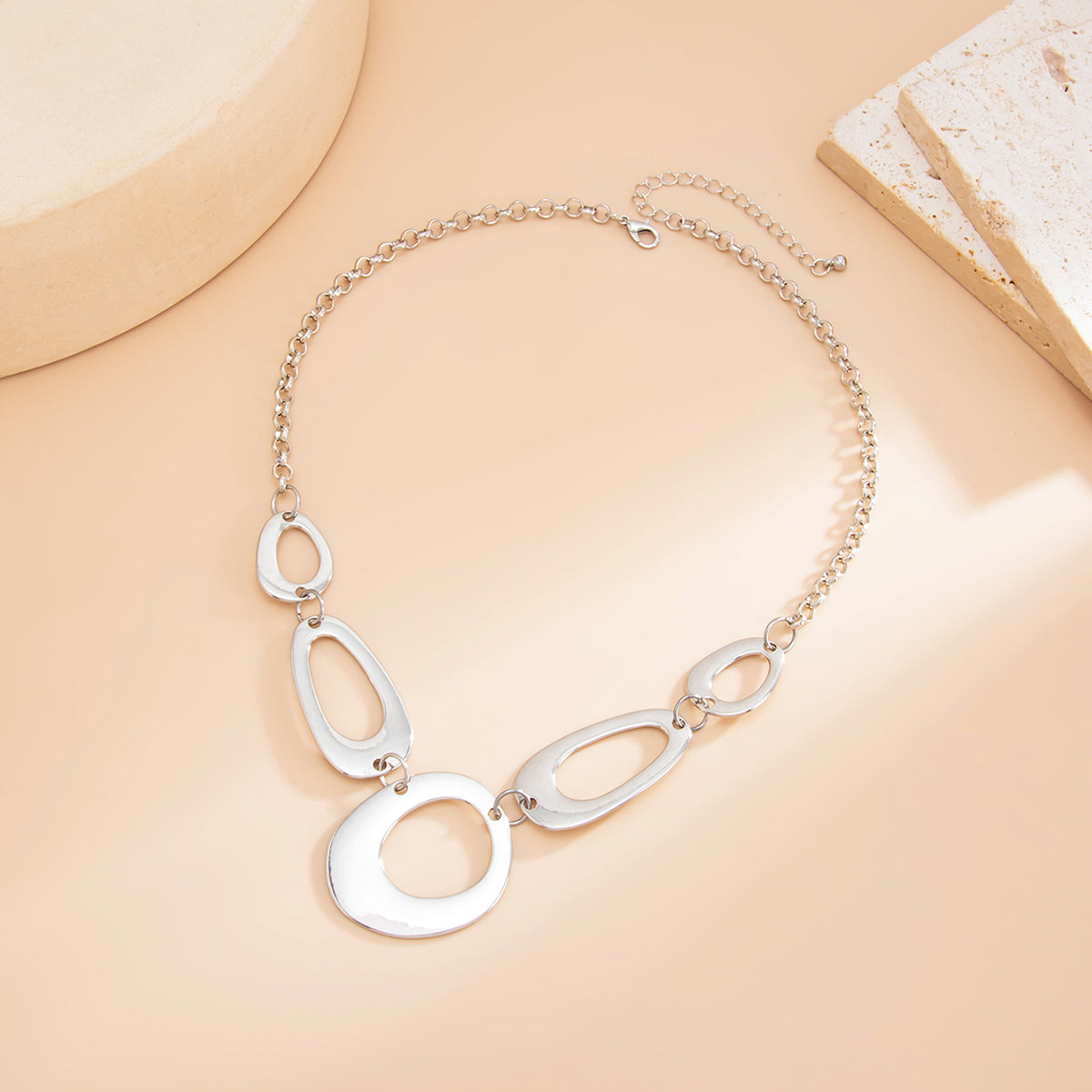 Silvertone Open Geometric Necklace, botanical inspired, side view