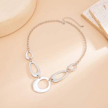 Silvertone Open Geometric Necklace, botanical inspired, side view
