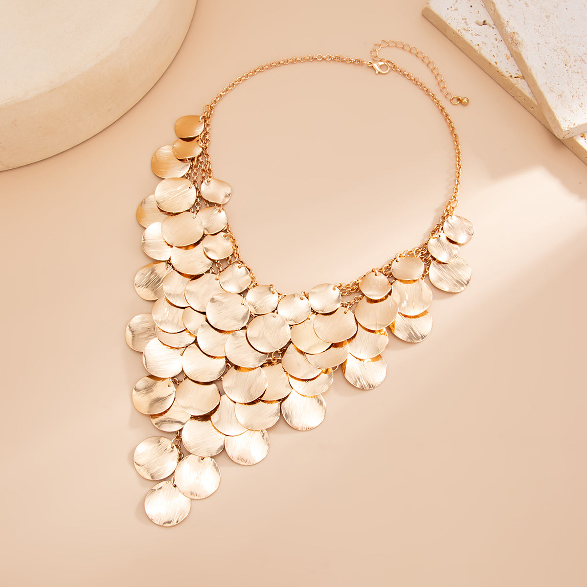 Goldtone Disc Tassel Statement Necklace, vintage-inspired design, side view