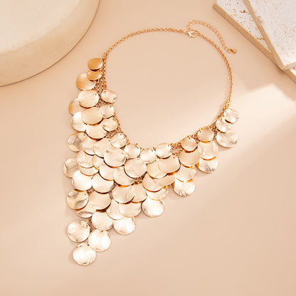 Goldtone Disc Tassel Statement Necklace, vintage-inspired design, side view