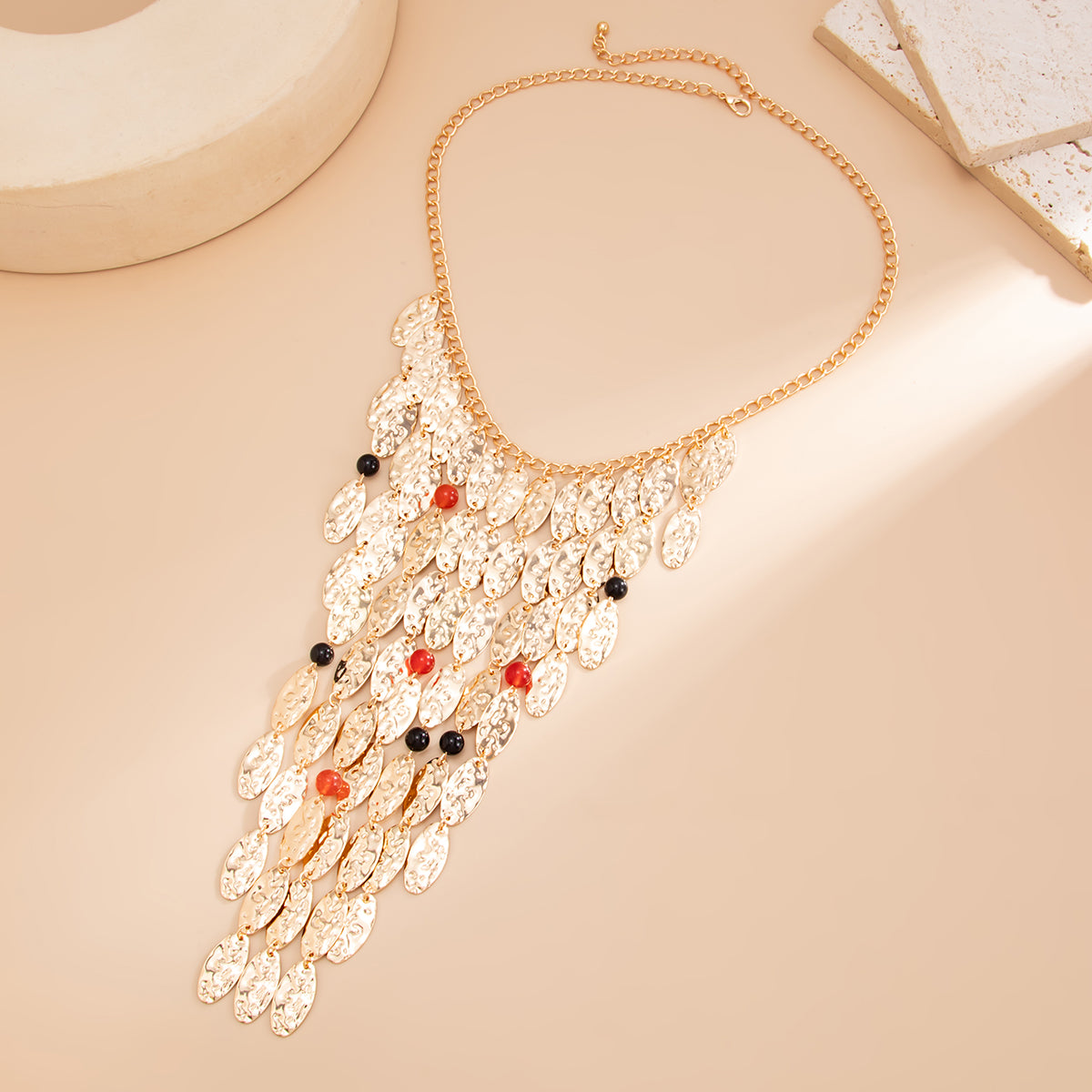 Resin and Goldtone Hammered Leaves Tassel Statement Necklace, dainty minimalist design, side view