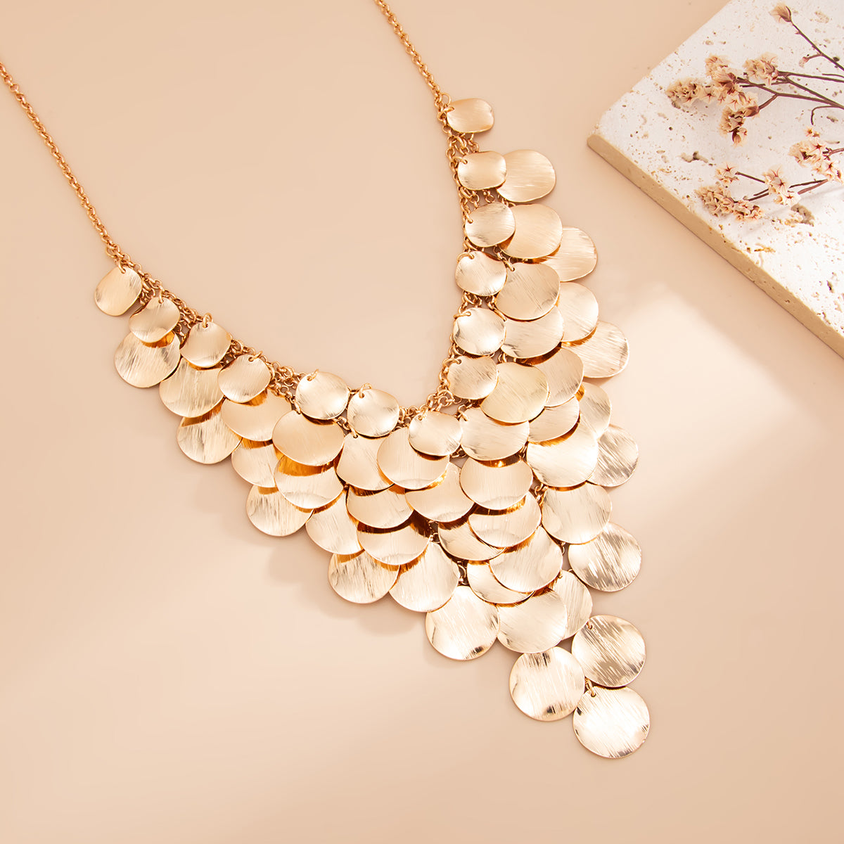 Goldtone Disc Tassel Statement Necklace, vintage-inspired design, detail close-up