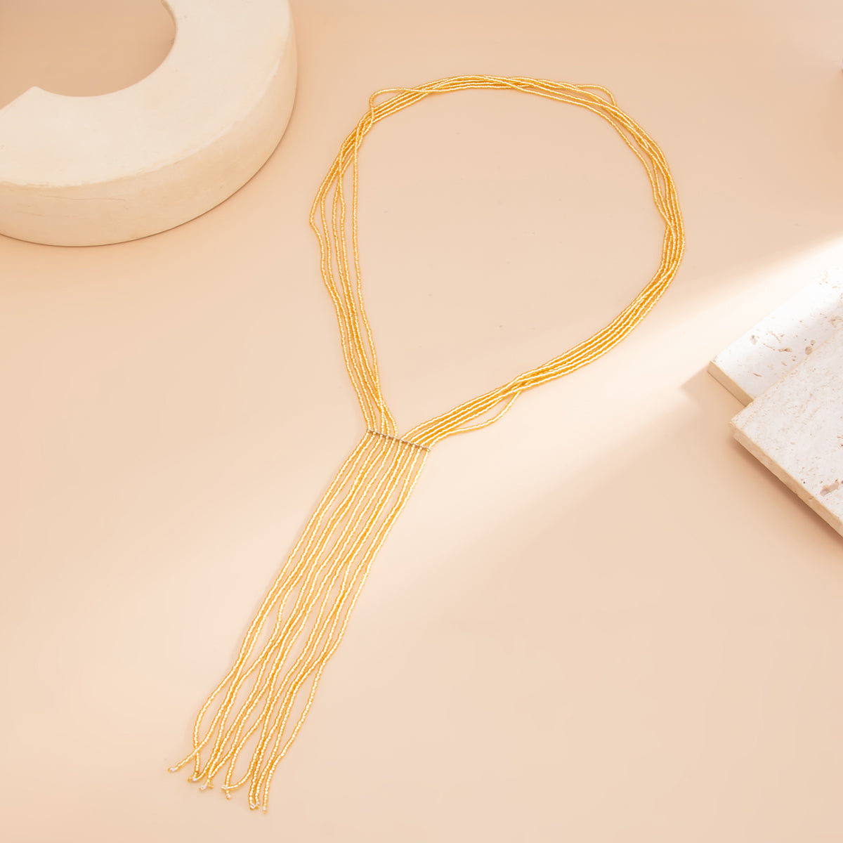 Goldtone Acrylic Multi-Strand Tassel Statement Necklace, dainty minimalist design, side view