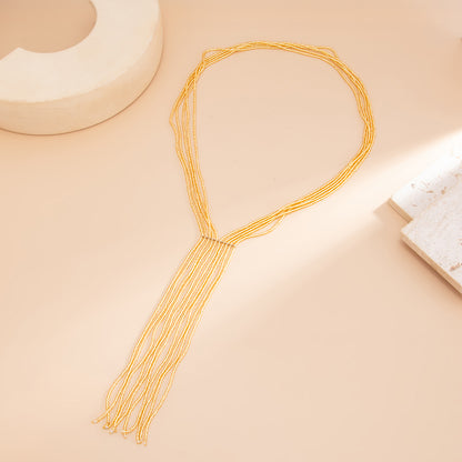 Goldtone Acrylic Multi-Strand Tassel Statement Necklace, dainty minimalist design, side view
