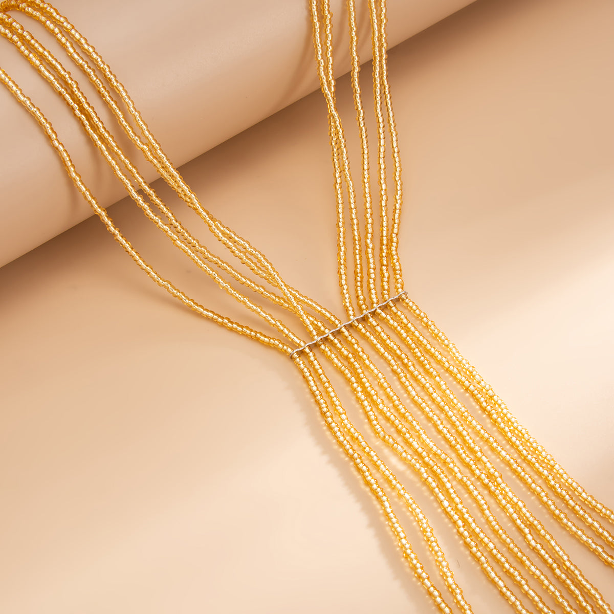 Goldtone Acrylic Multi-Strand Tassel Statement Necklace, dainty minimalist design, detail close-up