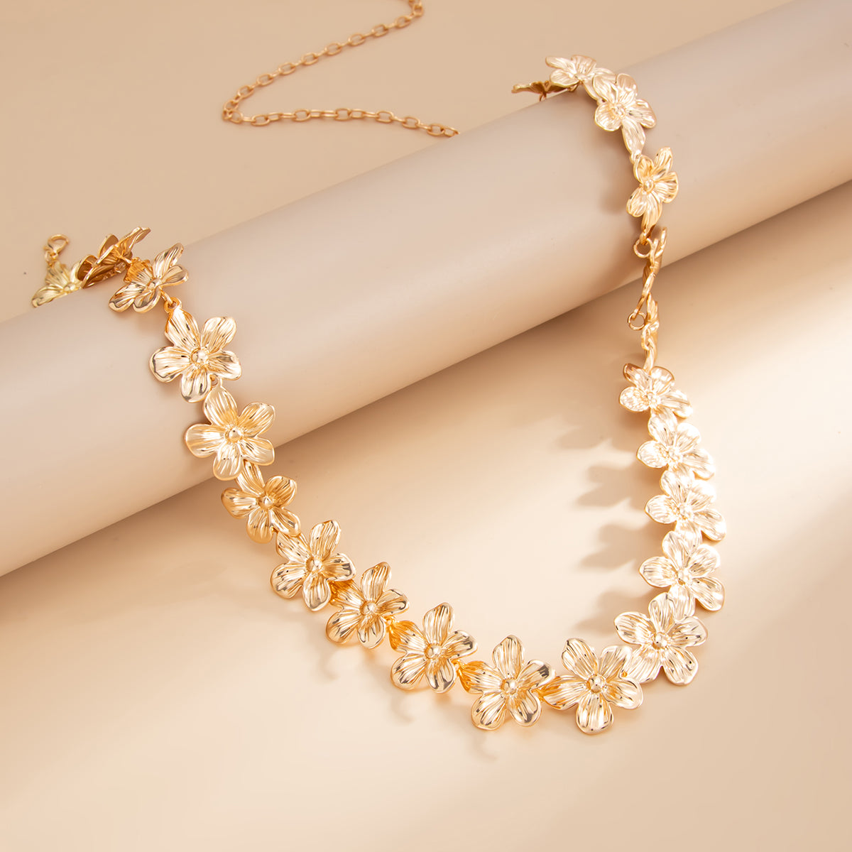 Goldtone Flower Link Waist Chain, dainty minimalist design, side view