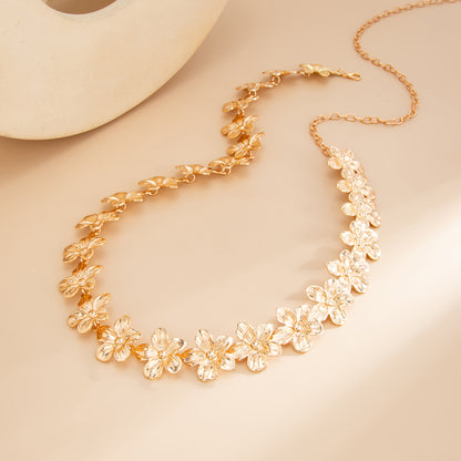 Goldtone Flower Link Waist Chain, dainty minimalist design, detail close-up
