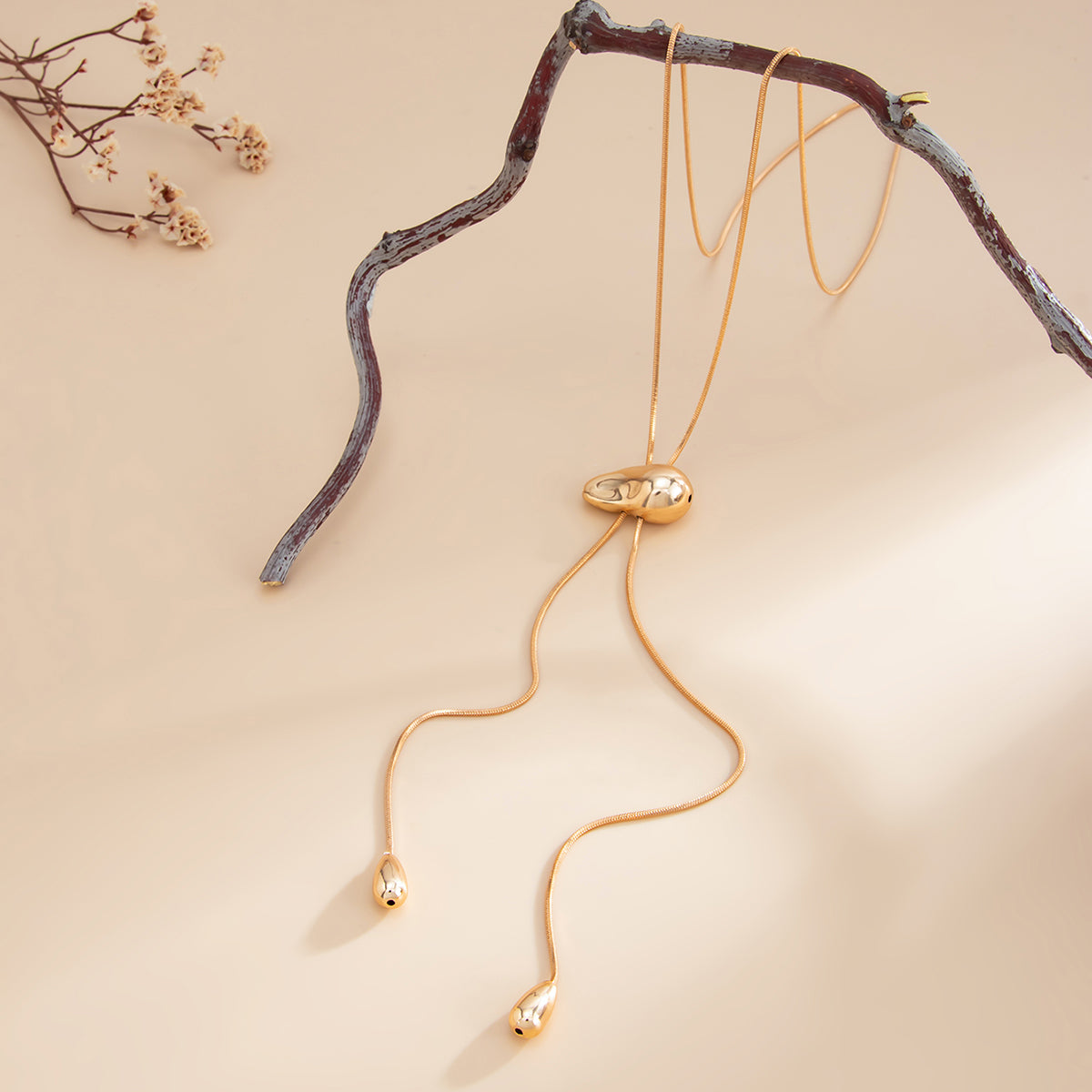 Goldtone Drop Tassel Lariat Necklace, vintage-inspired design, detail close-up